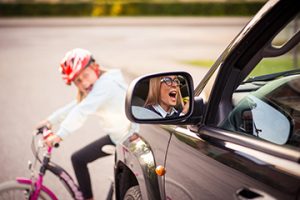 AccidentSmallGirlOnTheBicycleCrossesTheRoadIn - Meineke New Hampshire Brakes | Meineke Car Care | Amherst, NH